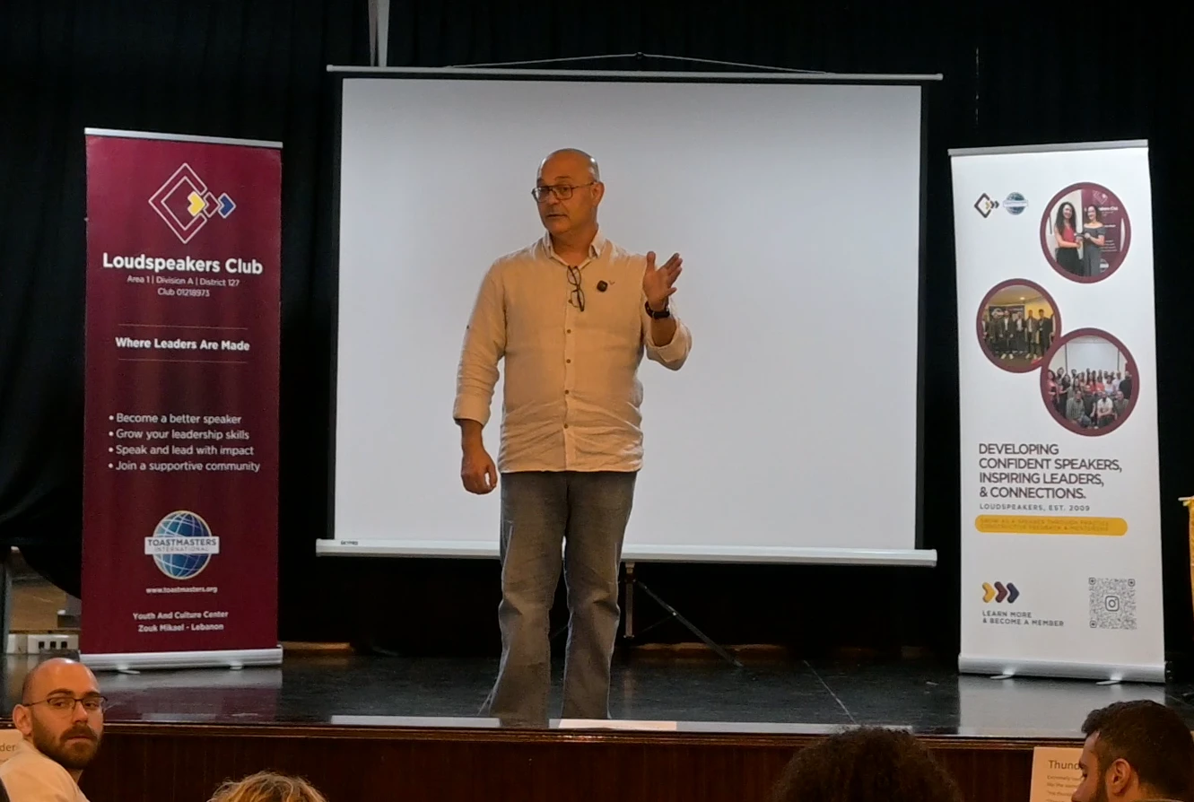 Elio Haddad mid-speech at Loudspeakers Toastmasters Club, Beirut